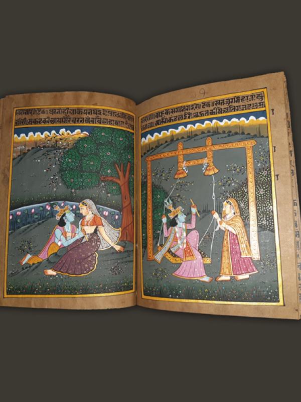 Pages (illustrated by hand) of a Hindi manuscript from the 1800s on the story of Rada and Krishna. 