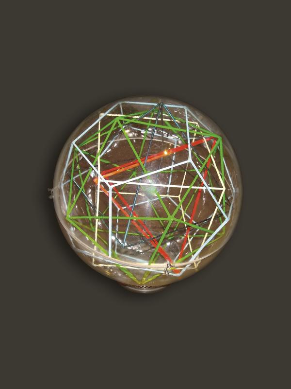 Transparent sphere containing five polyhedra, made by Adriano Graziotti in 1980.
